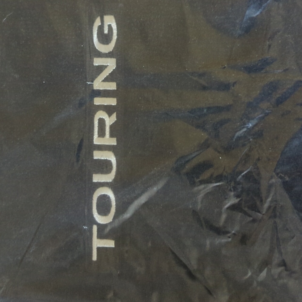 Subaru Outback Touring floor mats. Black with brown trim. Never opened